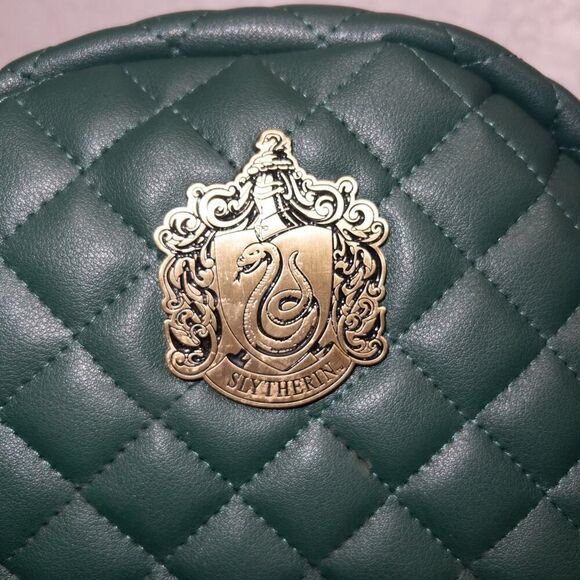 harry potter slytherin quilted mini backpack House Sport This bag features the Slytherin house crest against a satin banner with a real tassel dangling from the end Women's Bioworld Harry Potter Slytherin